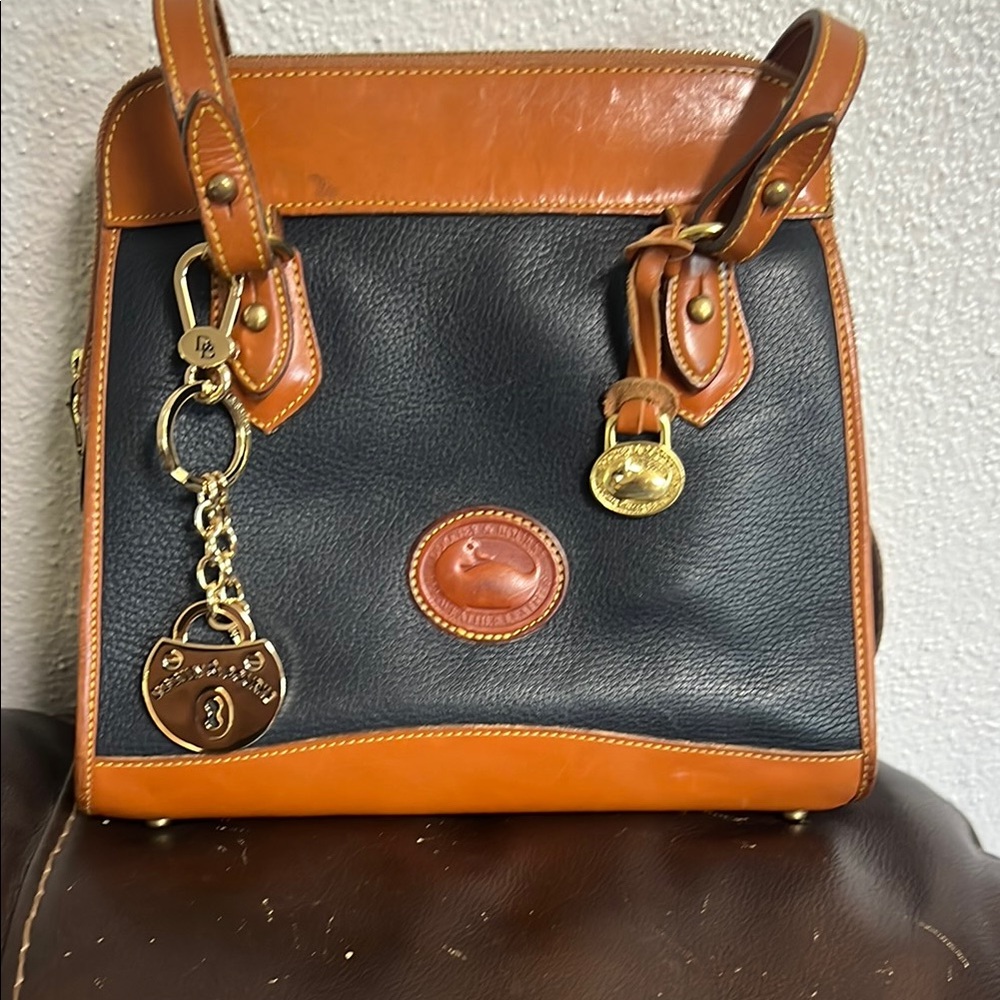 Dooney & Bourke Black and Tan Shoulder Bag with Structured Design